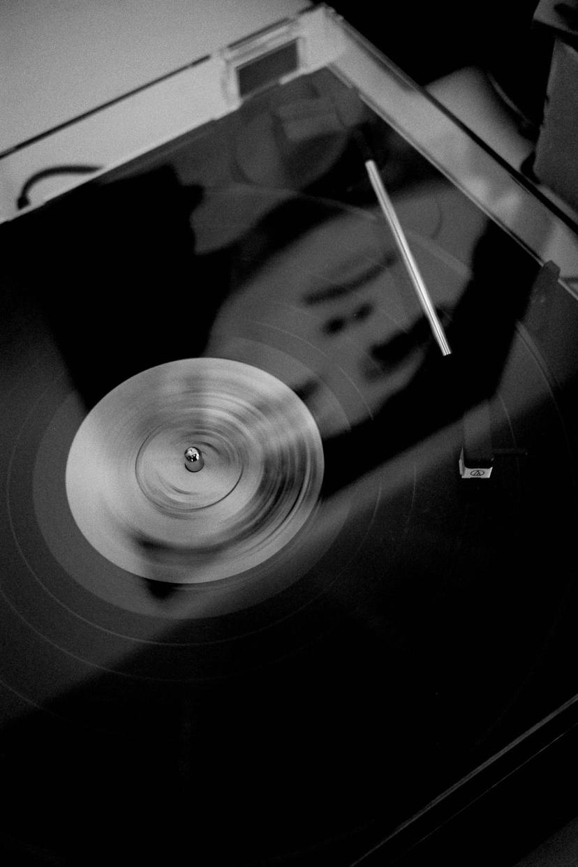 Record player with motion blur and reflection of painting